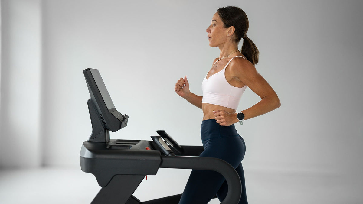 Woman running on a TRUE treadmill
