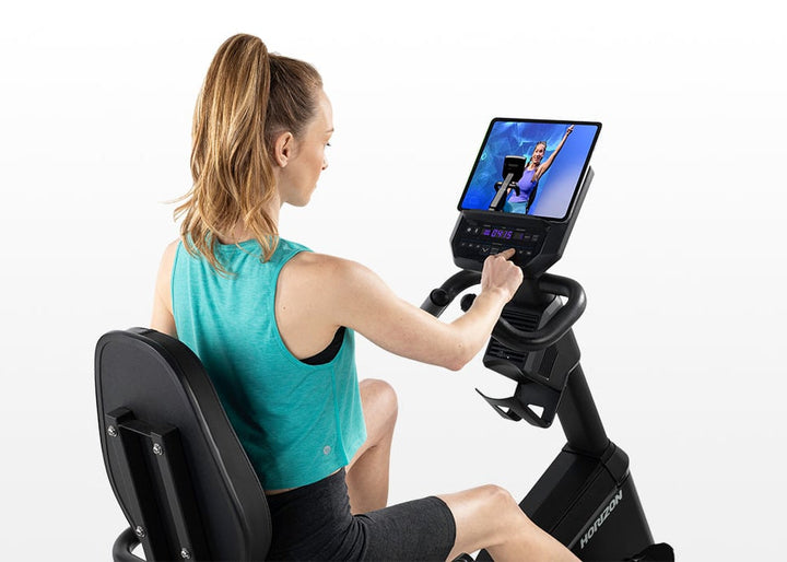 Horizon 5.0R built-in tablet holder with a tablet streaming a workout