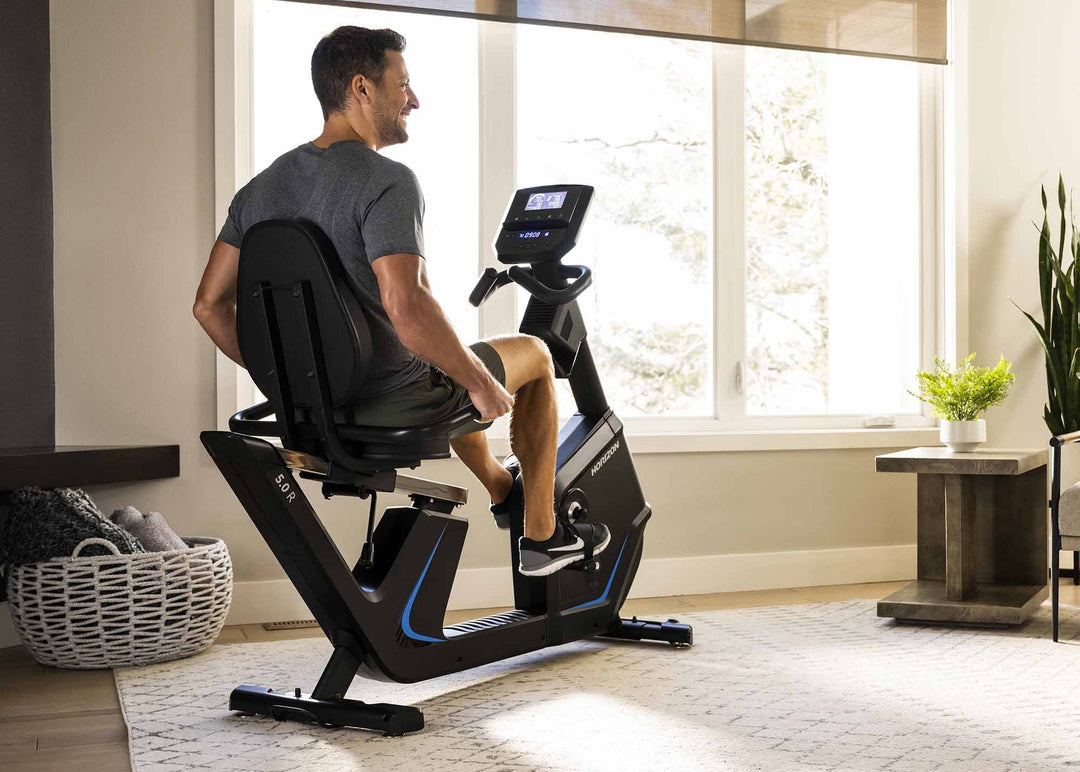 Horizon 5.0R Recumbent Bike in a modern living room