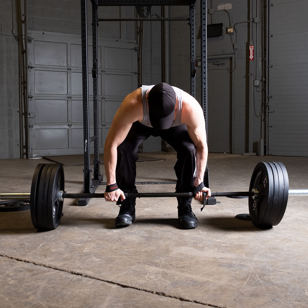 Cast iron Olympic weight plates on a barbell