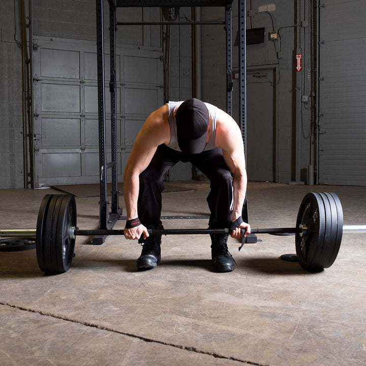 Cast iron Olympic weight plates on a barbell