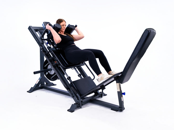 Bodycraft F760 – model performing a hack squat under the shoulder pads