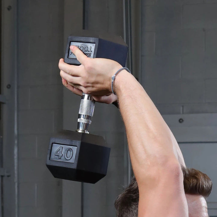 Hand gripping a rubber hex dumbbell with a knurled chrome handle