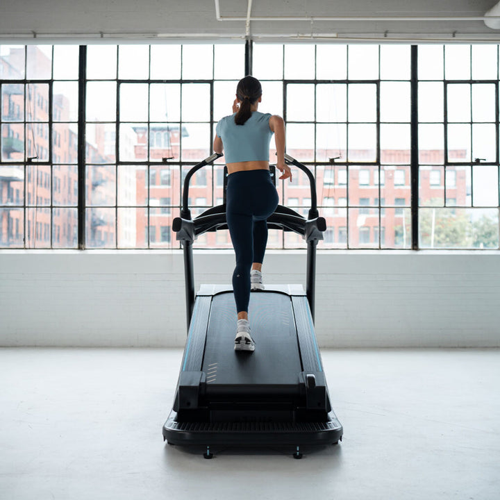 True Fitness Alpine Runner Incline Treadmill in use