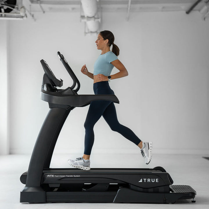 True Fitness Alpine Runner Incline Treadmill in use