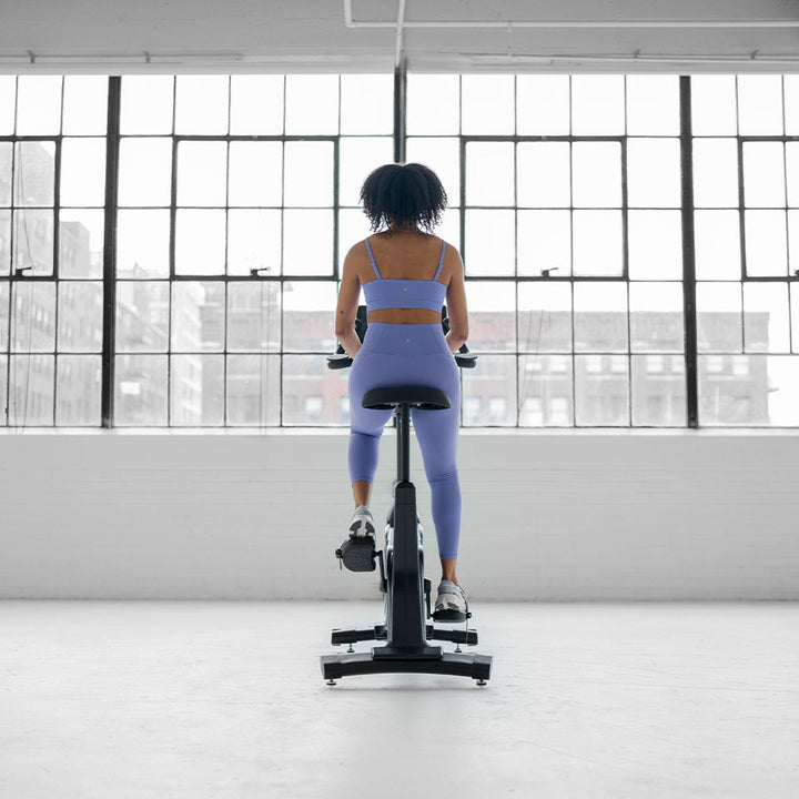 True Fitness Apex Upright Bike in use