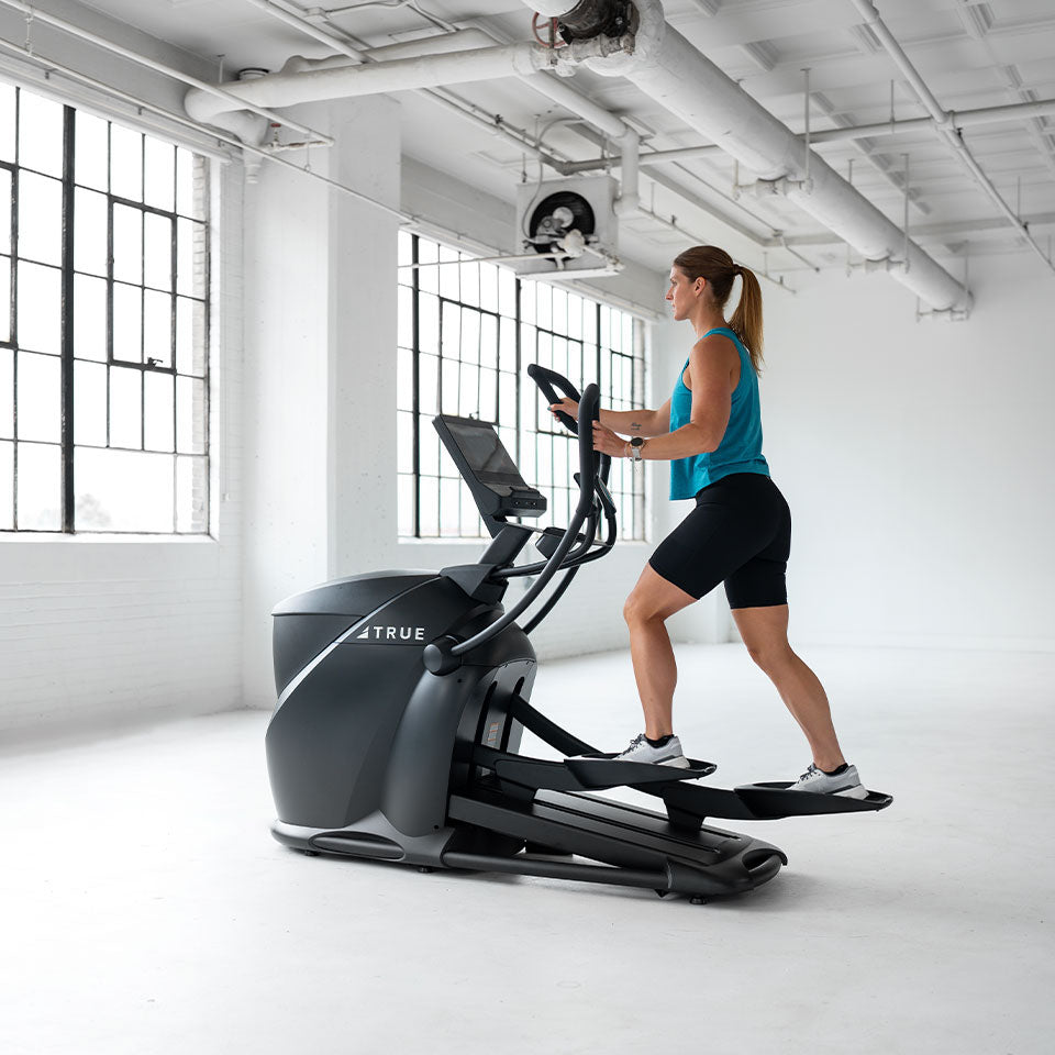 True Fitness Gravity Cross Trainer in use