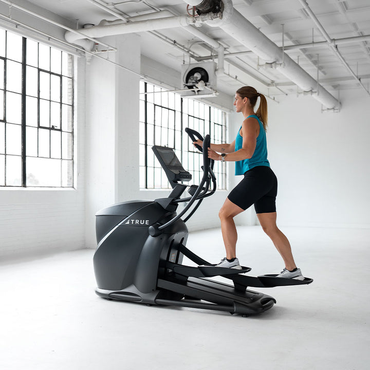 True Fitness Gravity Cross Trainer in use