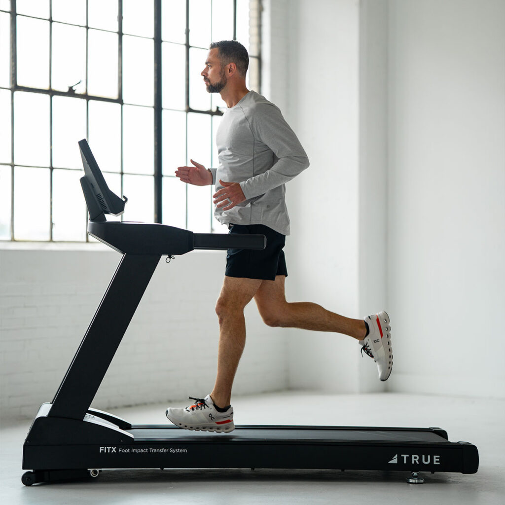 True Fitness Gravity Treadmill in use