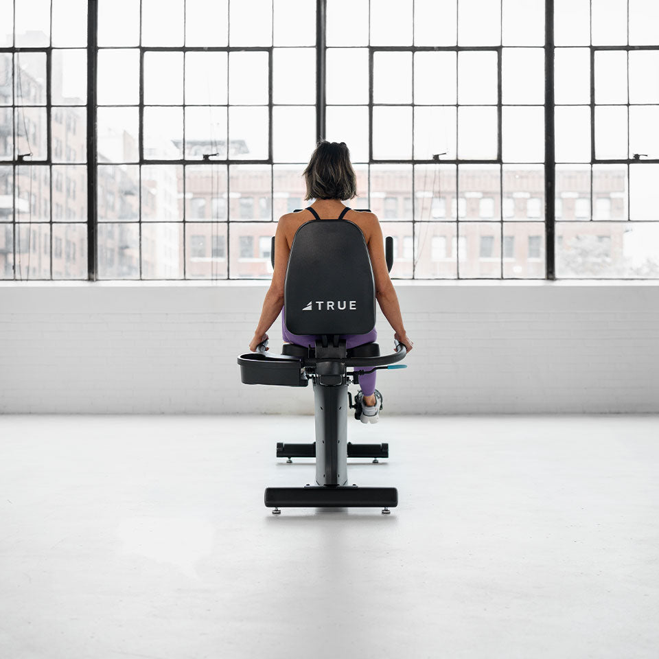True Fitness Launch Recumbent Bike in use