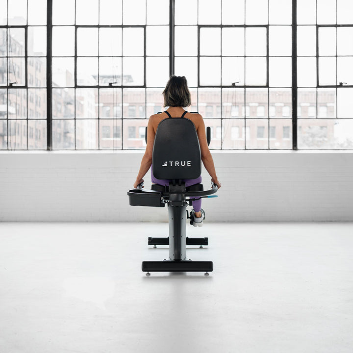 True Fitness Launch Recumbent Bike in use