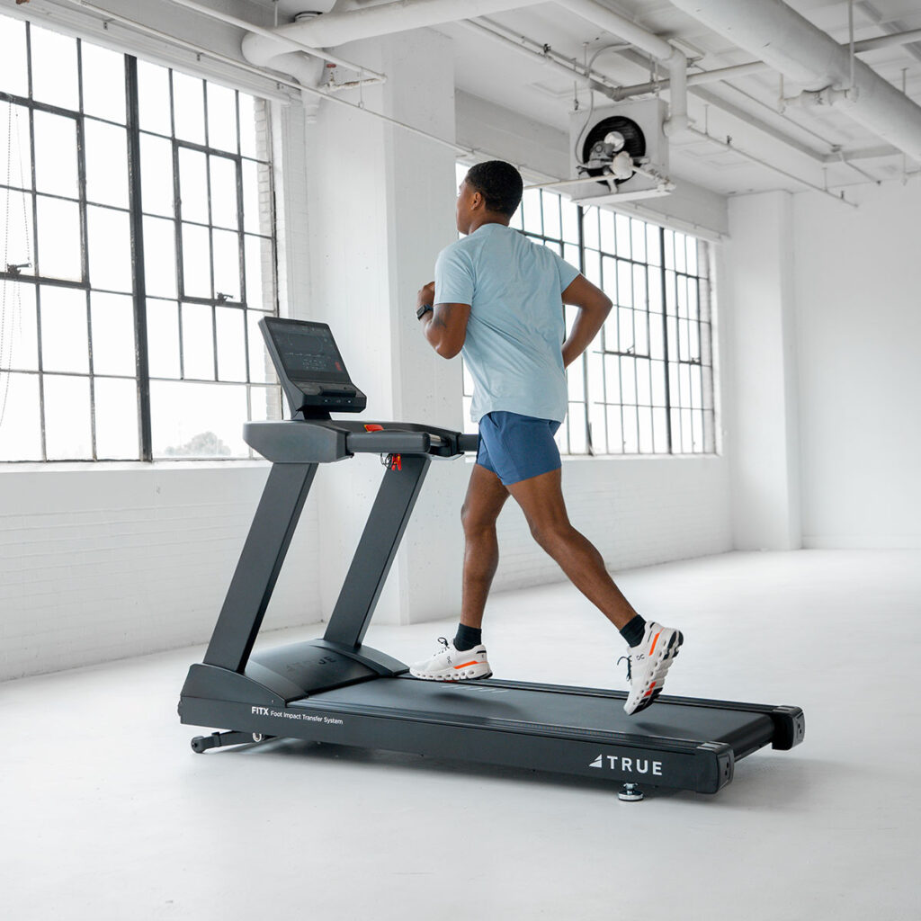 True Fitness Launch Treadmill in use