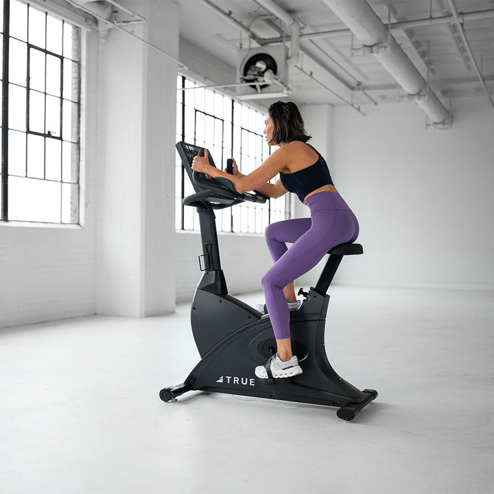 True Fitness Launch Upright Bike in use