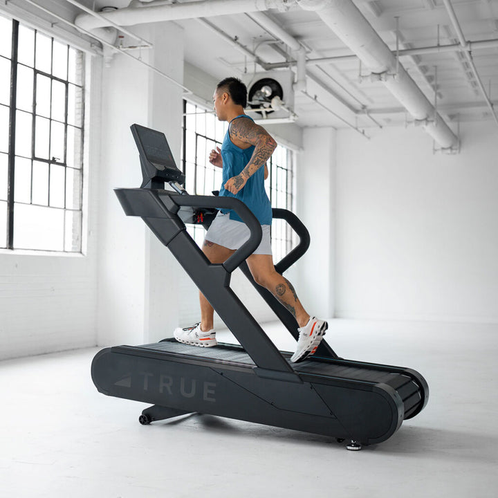 True Fitness Stryker Slat Treadmill in use